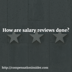 How are salary reviews done